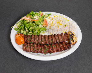 Mediterranean beef koobideh kabob with saffron basmati rice and grilled tomato at Jasmine Grill & Cafe