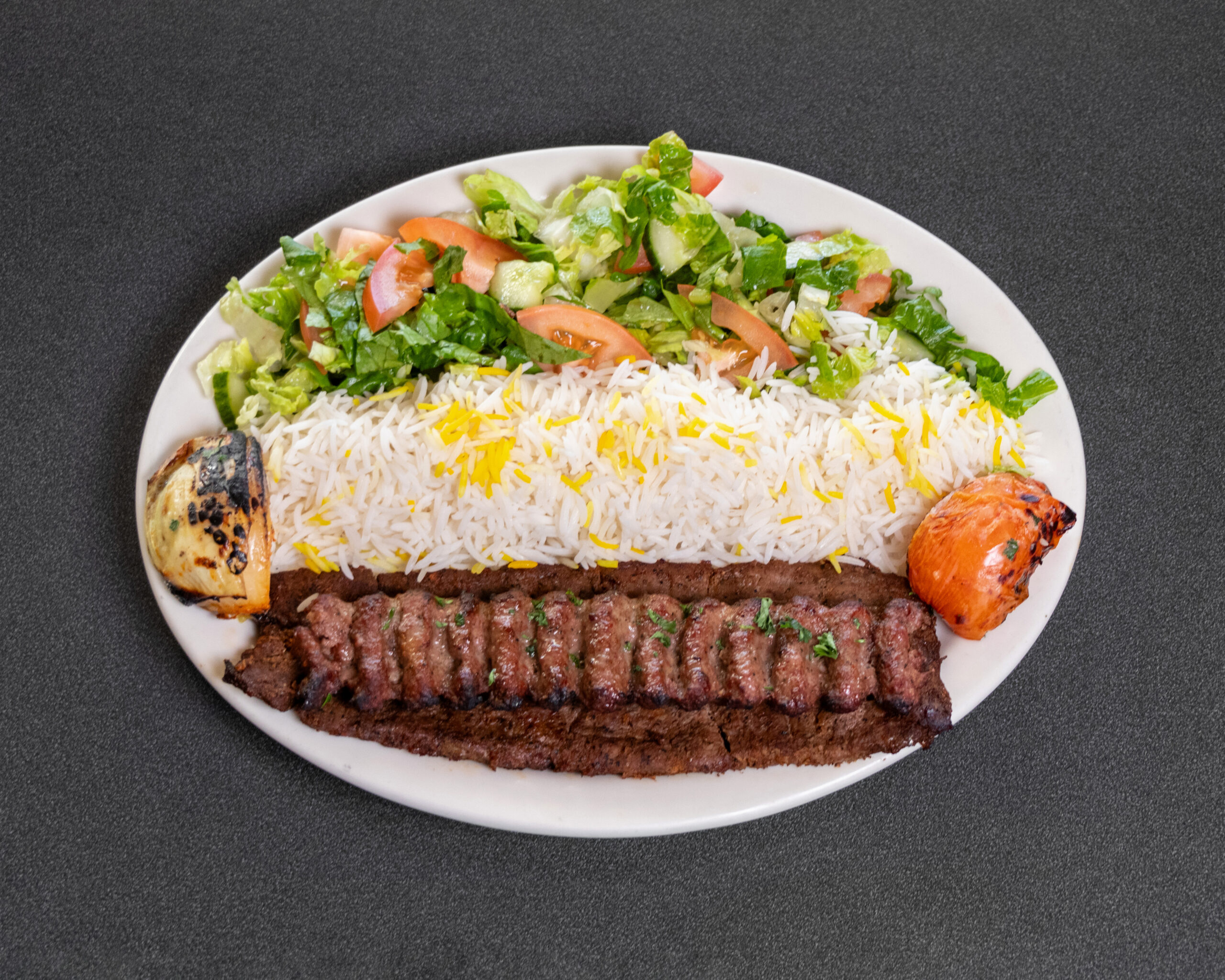 Mediterranean beef barg kabob with hummus, basmati rice and fresh salad at Jasmine Grill & Cafe