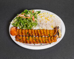 Mediterranean chicken koobideh kabob with saffron basmati rice and grilled tomato at Jasmine Grill & Cafe