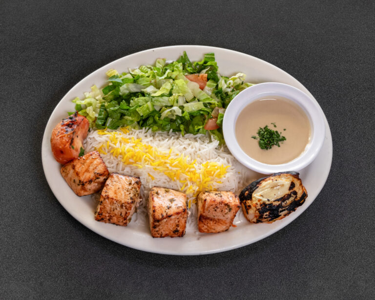 Mediterranean grilled salmon plate with saffron basmati rice and fresh salad at Jasmine Grill & Cafe