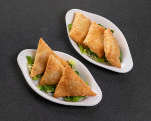 Mediterranean beef and cheese sambousek pastries served as an appetizer at Jasmine Grill & Cafe